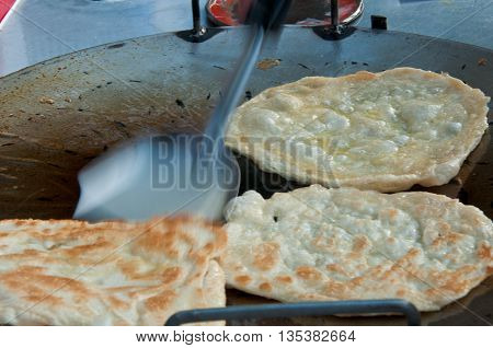 business man make indian food gourmet Southern Flat Bread Fry Pan rotee
