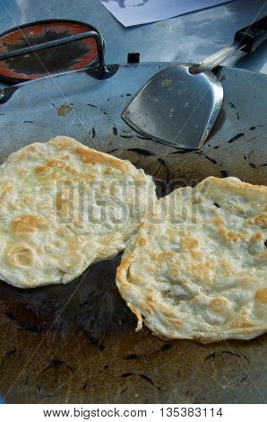 business man make indian food gourmet Southern Flat Bread Fry Pan rotee