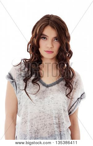 Young unhappy woman with long dark hair.