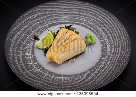 Japanese Cuisine. Sushi. Tomago  Sashimi On A Round Plate