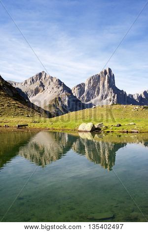 Peaks reflected in Ansabere Lake. Lescun Cirque. Aspe Valley, Pyrenees, France.