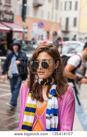 MILAN ITALY - JUNE 19: Fashionable woman poses outside Missoni fashion show building during Milan Men's Fashion Week on JUNE 19 2016 in Milan.