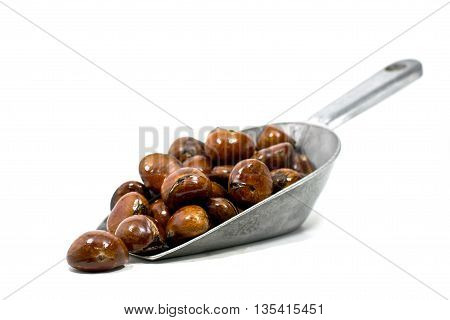 Chestnuts in metal scoop On a white background