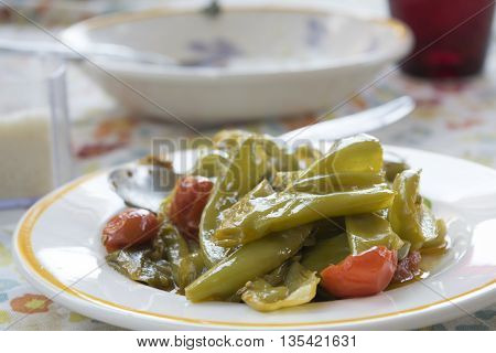 peperonata or fried peppers italian style with friarelli and cherry tomatoes