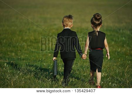 photo of young boy and girl playing spy