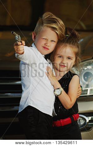 photo of young boy and girl playing spy