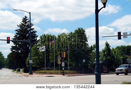 JOLIET, ILLINOIS / UNITED STATES - JUNE 1, 2015: The City of Joliet proudly flies the American flag, the POW-MIA flag, and the Joliet city flag, on a street corner in Joliet.