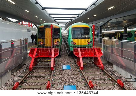 LONDON ENGLAND - OCTOBER 21: Trains at a platform on London Bridge station. In terms of passenger arrivals and departures it is the fourth-busiest station in London as well as the United Kingdom as a whole handling over 54 million customers a year.