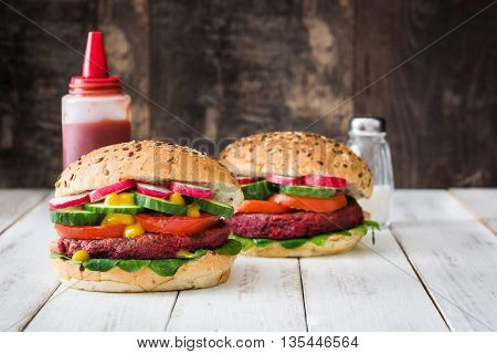 Veggie beet burgers on white wooden table