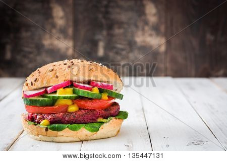 Veggie beet burgers on white wooden table