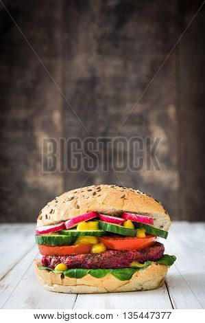 Veggie beet burgers on white wooden table