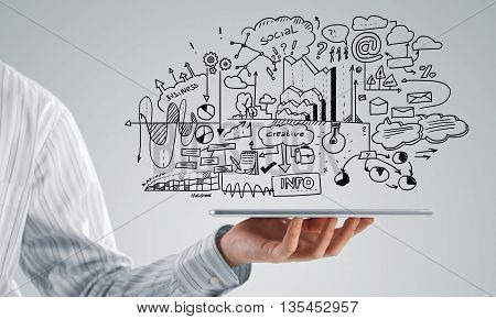 Businessman hand demostrating business strategy plan on tablet screen