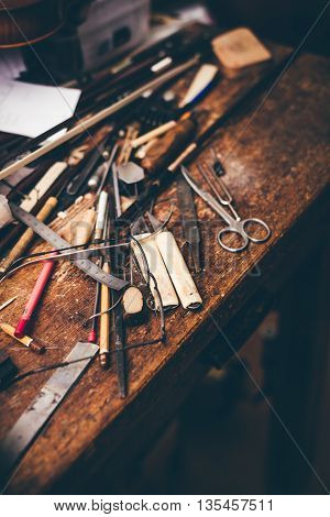 Old style luthier wooden working table top view