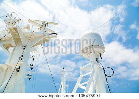 Sattelite communication antenna and radar mast of the cago ship.