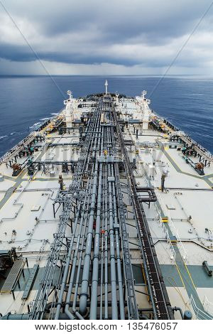 Oil tanker deck with pipeline for oil transfer.