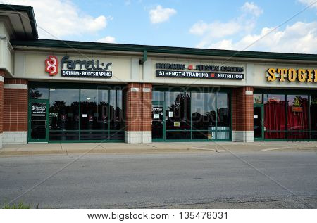 NAPERVILLE, ILLINOIS / UNITED STATES - JULY 23, 2015: Farrell's Extreme Body Shaping offers fitness programs in a Naperville strip mall.