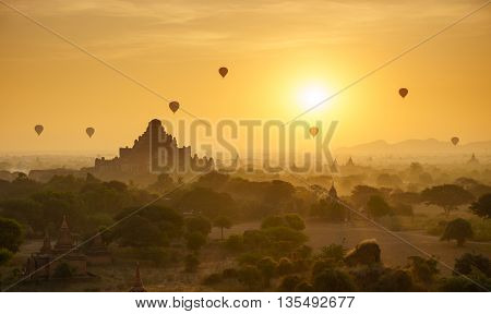 Hot air balloon over plain of Bagan in misty morning Myanmar