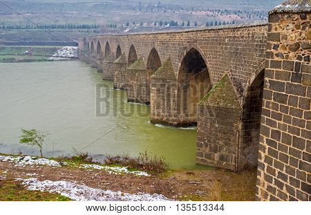The Dicle Bridge is one of the most popular historic landmarks located adjacent to Diyarbakir Turkey.