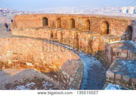The huge walls of the old citadel rise over the city of Ankara Turkey.