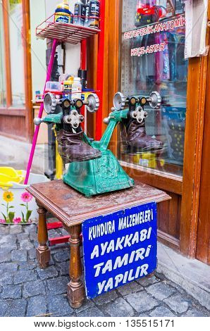 ANKARA TURKEY - JANUARY 16 2015: The vintage machine for making repair and stretching shoes is the nice commercial for the traditional workshop in the city center on January 16 in Ankara.