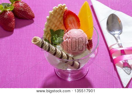 Strawberry ice cream dessert in a glass cup