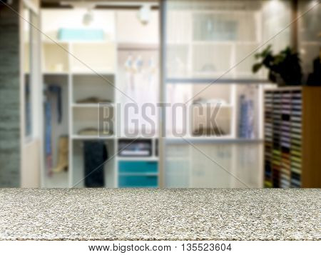 Marble board empty table in front of blurred background. Perspective merble over blur in closet room for background uses. Mock up for display of product.