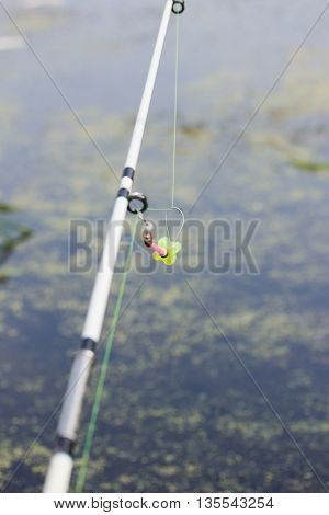 The tip of the rod with the bell.