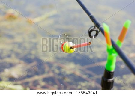 The tip of the rod with the bell.