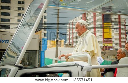 QUITO, ECUADOR - JULY 7, 2015: Pope Francisco around Quito streets in his popemobile, stand up.