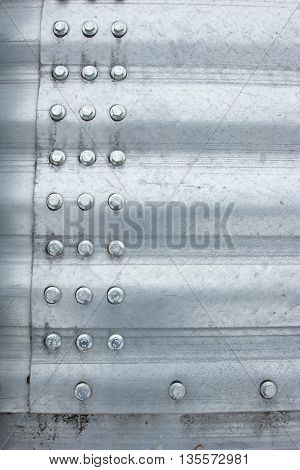 Metal background. 
metal rivets on stainless steel silver