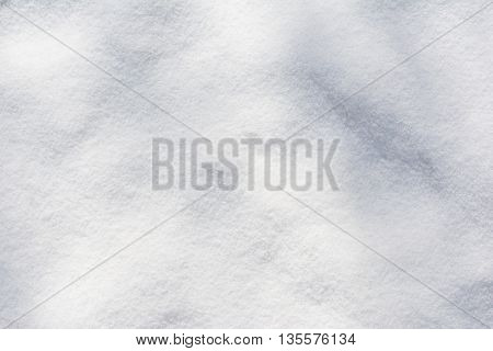 texture of a white fresh snow at afternoon