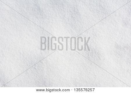 texture of a white fresh snow at afternoon