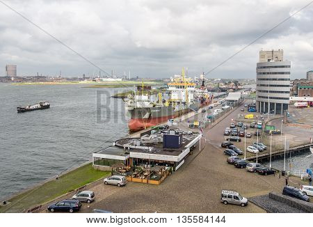 IJMUIDEN, NETHERLANDS - 15 SEPT. 2015: Hopper dredger in the harbor of IJmuiden. The port of IJmuiden is the largest fishing port of the country and is also the port of departure for many ferries