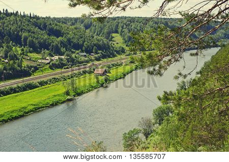 The view of the river Sylva railway building forest cliff which rises above the river for forty meters Is called the Yermak stone.