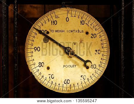 SWINDON, ENGLAND, 5 MARCH 2016. Old Pooley Weighing Scale Showing 100lb or Short Hundredweight, taken at Swindon's GWR Steam Museum in the UK