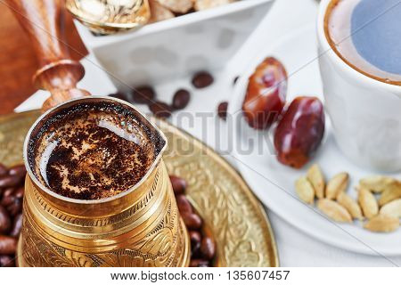 Traditional Turkish black coffee and sweet dainties
