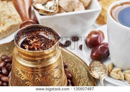 Traditional Turkish black coffee and sweet dainties