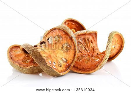 Bale Fruit dried tee. Isolated on white. Bale fruit is tropical fruit with hard exterior cover. The fruit has medicinal value for digestive system. Extensively consumed in rural India and Thailand.