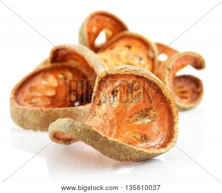 Bale Fruit dried tee. Isolated on white. Bale fruit is tropical fruit with hard exterior cover. The fruit has medicinal value for digestive system. Extensively consumed in rural India and Thailand.