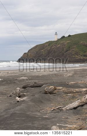 Waves crash up onto the rocks at North Head in Washington State