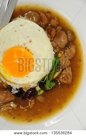 Fried rice with egg and pig on a plate