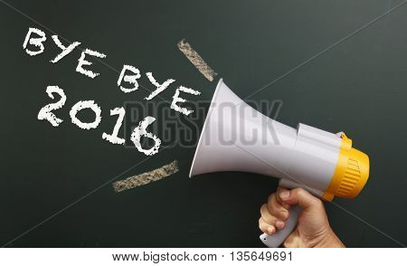 megaphone in front chalkboard with text bye bye 2016