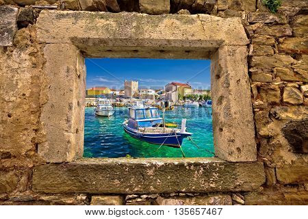 Razanac turquoise waterfront through stone window Dalmatia Croatia