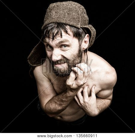 Dark portrait of scary evil sinister bearded man with smirk, makes various hand's signs and expresses different emotions. strange Russian man.