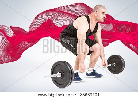Bodybuilder lifting heavy barbell weights against grey background