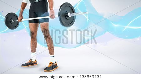Mid-section of bodybuilder lifting heavy barbell weights against grey background