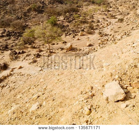 In Oman  The Old Mountain Gorge And Canyon The Deep Cloudy  Sky
