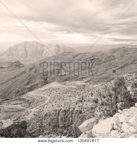 In Oman  The Old Mountain Gorge And Canyon The Deep Cloudy  Sky