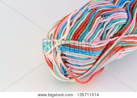 bale of wool of different colors with white background