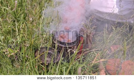 Beekeeper and smoker. Man with a smoker for bees